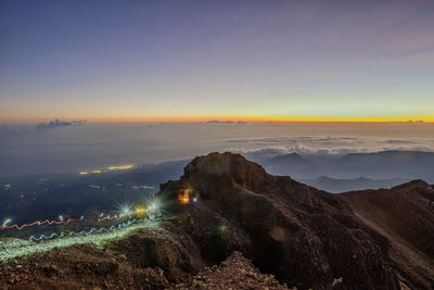 High angle view of illuminated mountain at night