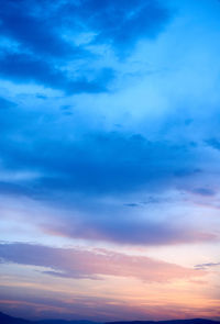 Low angle view of cloudy sky during sunset