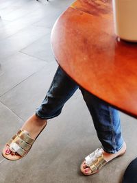 Low section of woman standing on floor