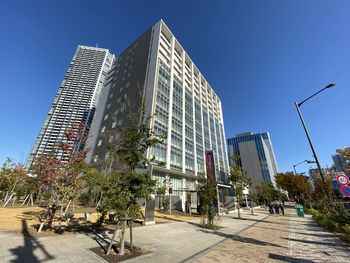 Low angle view of buildings against clear blue sky