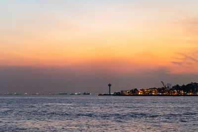 Crescent over bosphorus during october sunset in istanbul