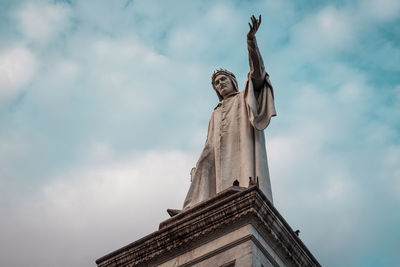 Low angle view of statue against cloudy sky