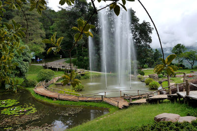 Fountain in park against sky