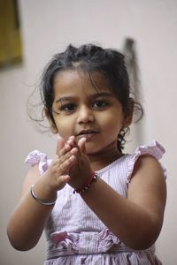 A baby girl washing hand