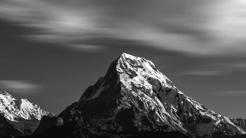 Scenic view of snowcapped mountain against sky