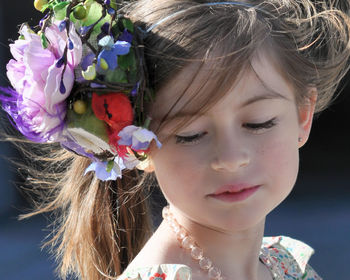 Close-up of woman holding flower