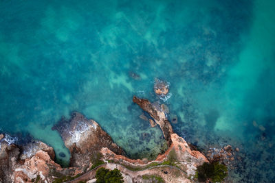 High angle view of rocks in sea