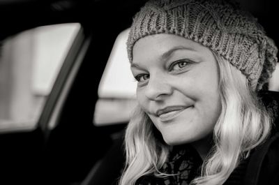 Close-up portrait of woman in car