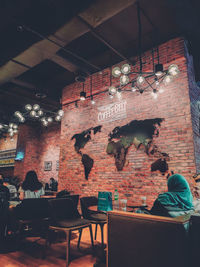 Rear view of people sitting in restaurant