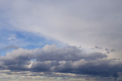 Low angle view of clouds over sea