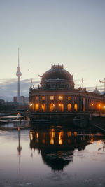 Reflection of illuminated buildings in water