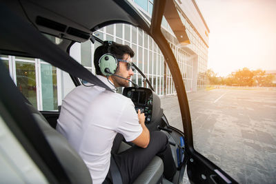 Man sitting in car