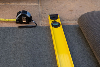 High angle view of yellow car on street