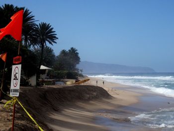 Scenic view of beach against clear sky