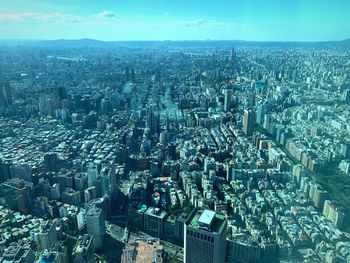 High angle view of modern buildings in city against sky