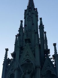 Low angle view of statue against building