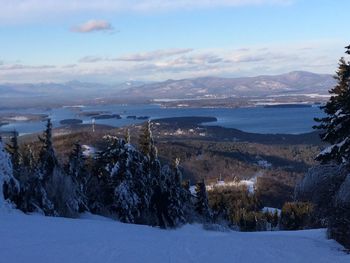 Scenic view of landscape against sky during winter