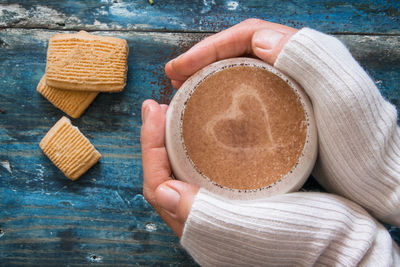 Directly above shot of woman holding cookies