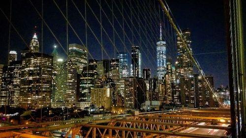 Illuminated modern buildings in city at night