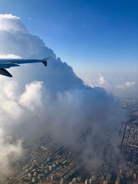 Aerial view of city and buildings against sky