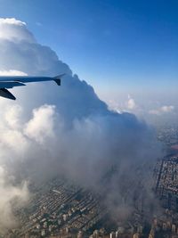 Aerial view of sky  and clouds of a plane window 