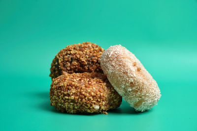 Close-up of bread on table against blue background