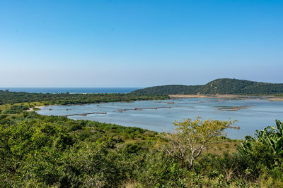 Scenic view of sea against clear blue sky