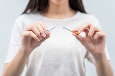 Midsection of woman holding hands