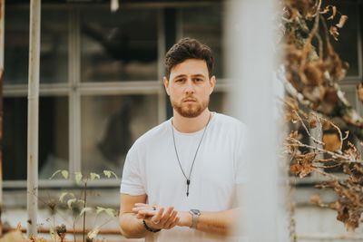 Portrait of young man standing outdoors