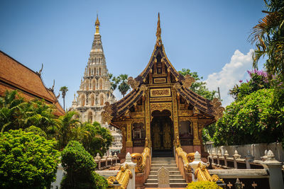 Panoramic view of temple amidst buildings against sky