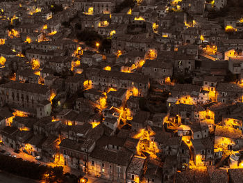 High angle view of illuminated buildings in city