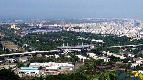 High angle view of buildings in city against sky