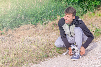 Full length of young man lying on land