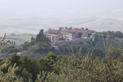 Built structure on landscape against the sky