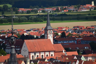 Houses in town against sky