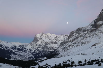 Scenic view of snowcapped mountains against sky during winter