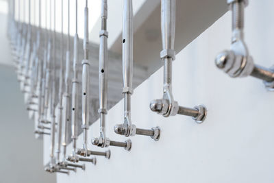 Close-up of metallic handrail on staircase