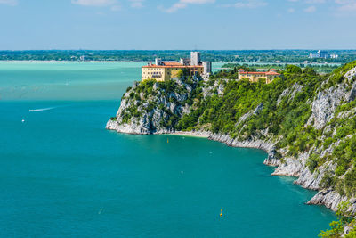 Gulf of trieste. high cliffs between boats, karst rocks and ancient castles. duino. italy