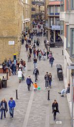 High angle view of people walking on street in city of london