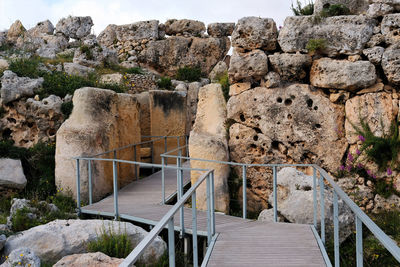 Staircase leading to stone wall