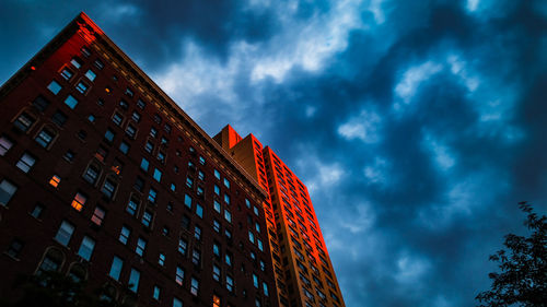 Low angle view of illuminated building against sky