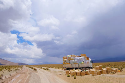 Panoramic shot of dirt road against sky