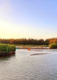 Scenic view of river against clear sky