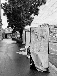 Empty road in city against sky