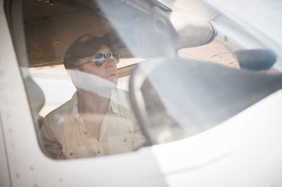 Pilot looking out cockpit window