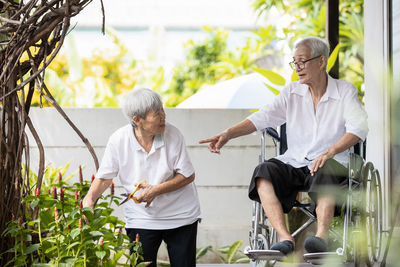 Rear view of people walking outdoors