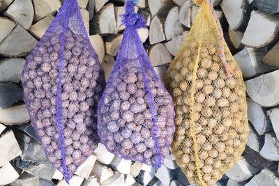 Bags with fresh walnuts drying