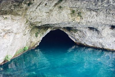 Sea seen through hole in cave