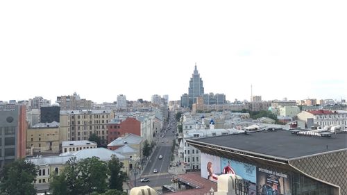 High angle view of buildings in city against clear sky
