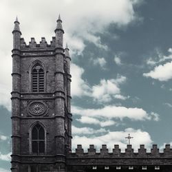 Low angle view of clock tower against sky